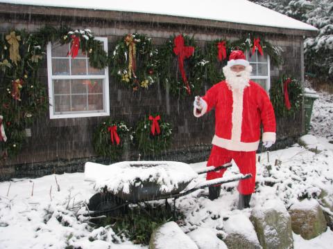 santa in front of the wreaths